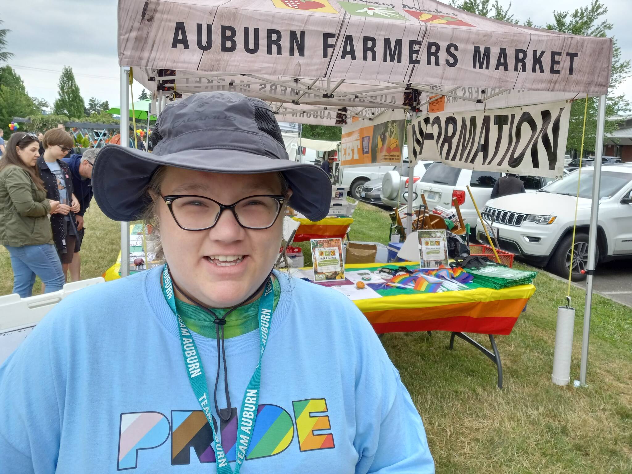 Photos by Robert Whale, Auburn Reporter
Auburn International Farmers Market Coordinator Amanda Valdez has her hands full with bustling market on Sundays at Auburn’s Les Gove Park.
