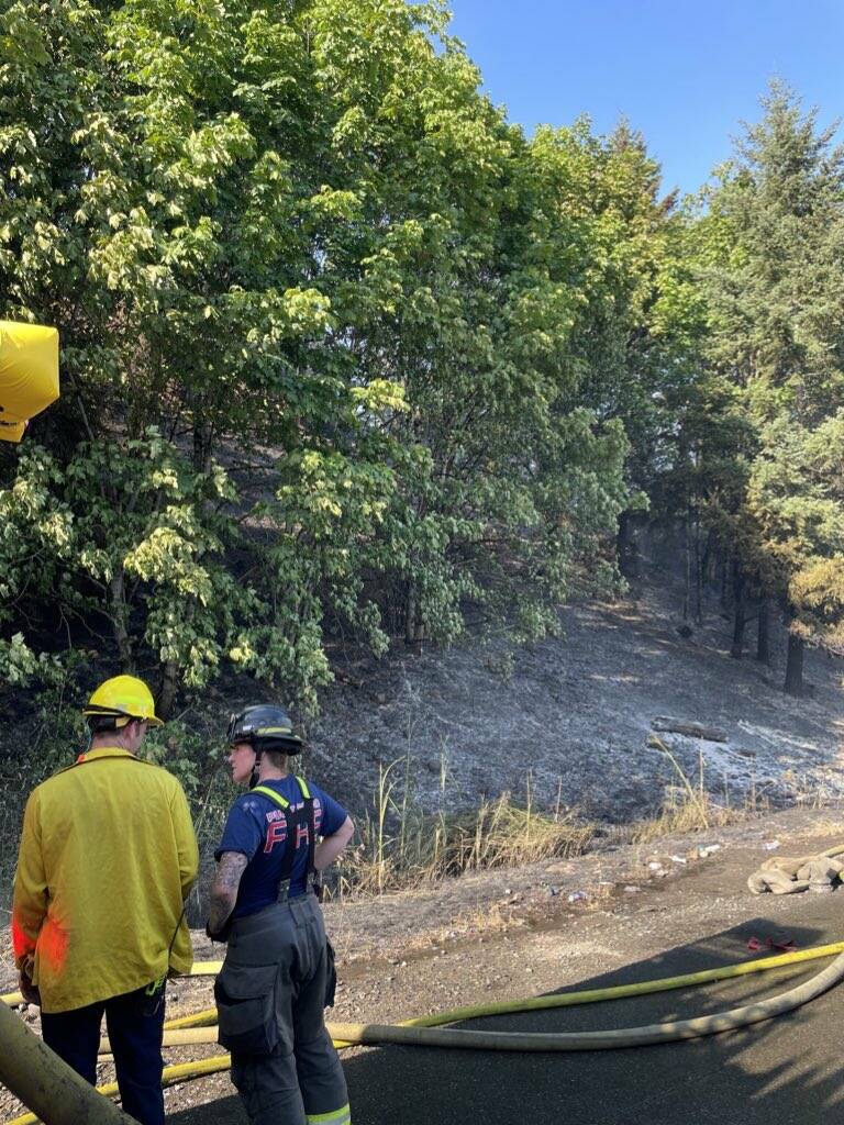 The fire spread on a steep hillside, growing to approximately two acres in size. (Courtesy of the Renton Regional Fire Authority.)