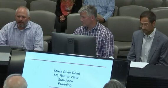 Jeff Tate, director of community development for the city of Auburn, Segale Properties spokesman Mike Pruett and Mark Segale address the Auburn City Council about the future redevelopment of key Segale holdings in Auburn, among them the gravel mining operation established 40 years ago on the city’s south end. (Photo by Robert Whale, Auburn Reporter)