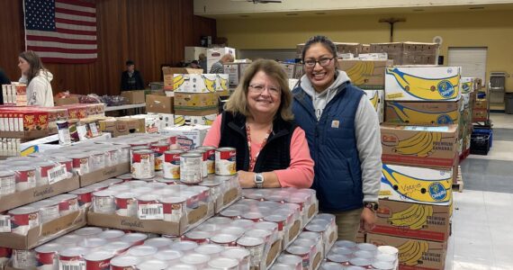 File photo: Debbie Christian and Leticia Brito of the Auburn Food Bank.