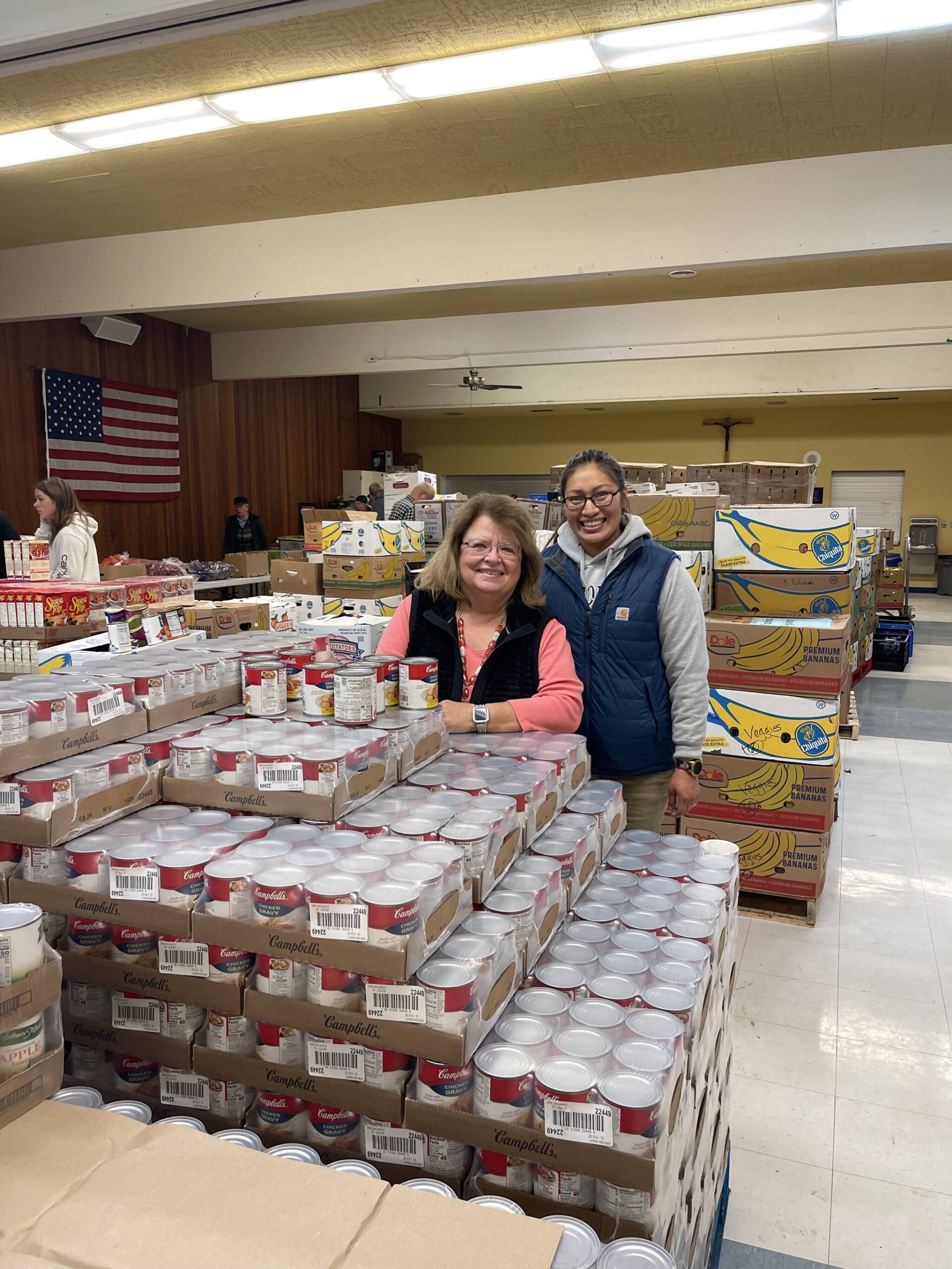 File photo: Debbie Christian and Leticia Brito of the Auburn Food Bank.