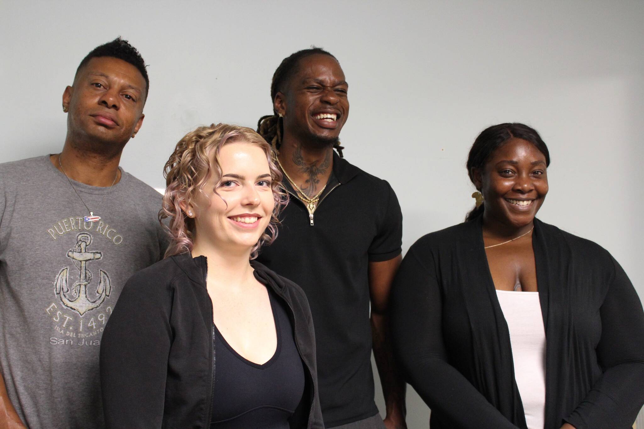 From left to right: mentor Ron Howell, resource navigator Adriane Karg, executive director De’Vonte’ Parson and COO Kechi Amaefule pose for a photo at the Pro Se Potential office in Federal Way. (Photo by Alex Bruell / Sound Publishing)