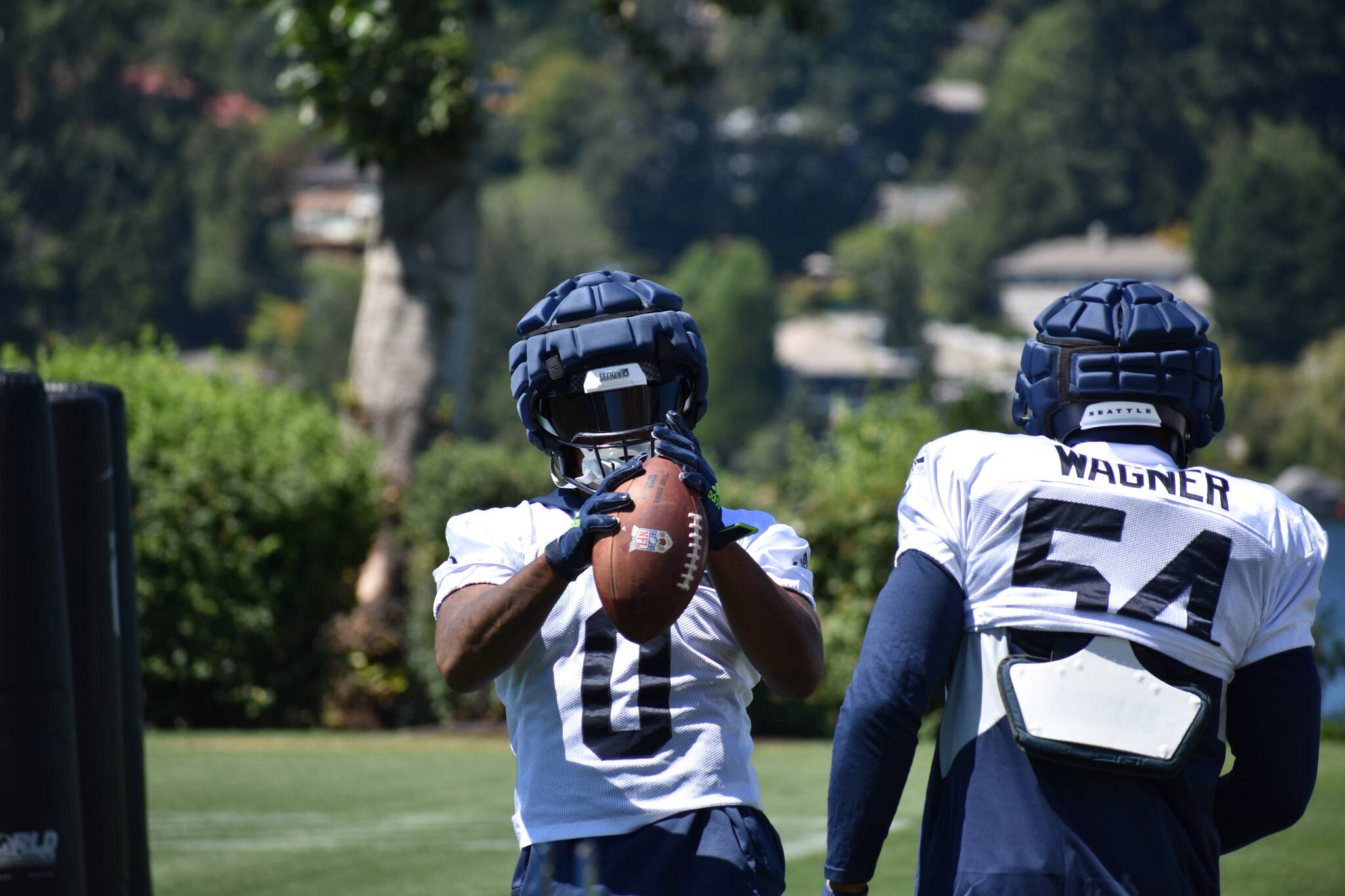 Devin Bush in front, working on his hands with fellow linebacker Bobby Wagner. (Photos by Ben Ray/Sound Publishing)