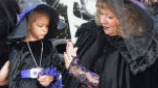 Courtesy photo, Auburn Parks, Arts and Recreation
A child and her witch companion enjoy the spooky goings-on at the Trunk or Treat event last year at Les Gove Park.
