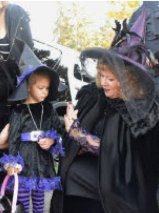 Courtesy photo, Auburn Parks, Arts and Recreation
A child and her witch companion enjoy the spooky goings-on at the Trunk or Treat event last year at Les Gove Park.