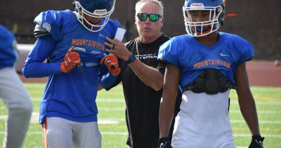 Head coach Kent Rodseth works with players in a drill. Ben Ray / The Reporter