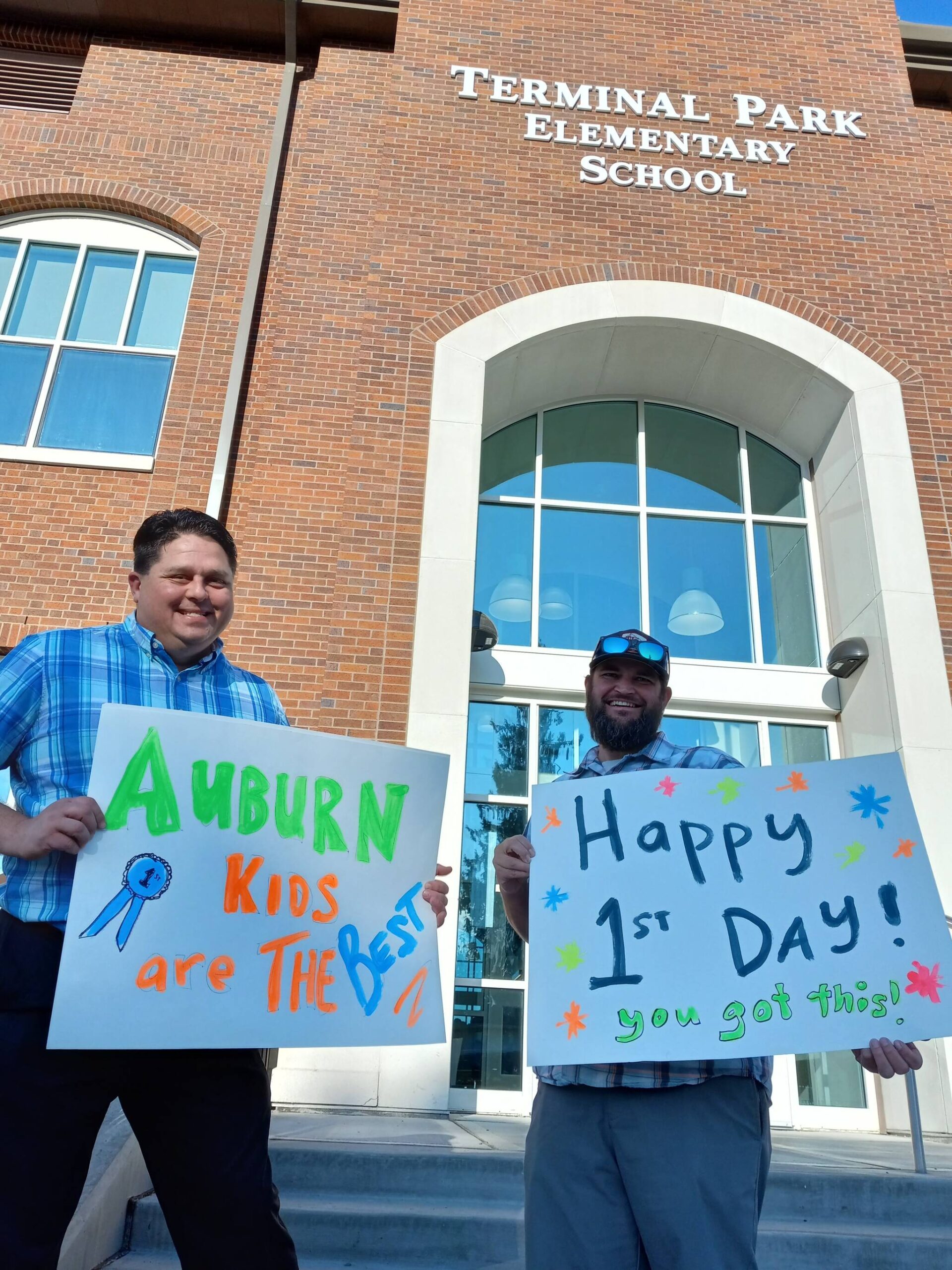 Former Terminal Park Elementary School Prinicipal Paul Harvey and his close friend Adam Shay celebrate the opening day of school and of the rebuilt Terminal Park Elementary School in south Auburn.
