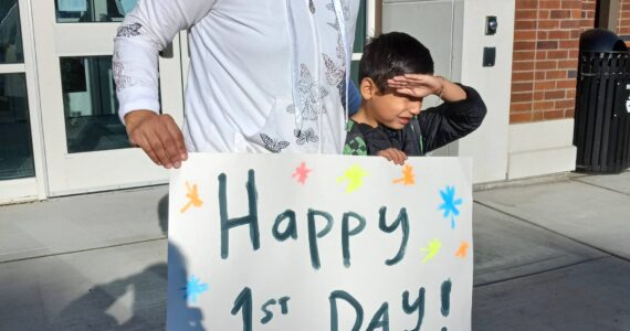 Shannon Moreno and her 6-year-old son, Jamie, prepare for the first day of school at the rebuilt Terminal Park Elementary School. Photo by Robert Whale, Auburn Reporter.