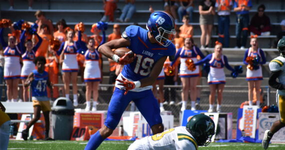 Auburn Mountainview's Jalen Hicks topples a defender. Ben Ray / The Reporter