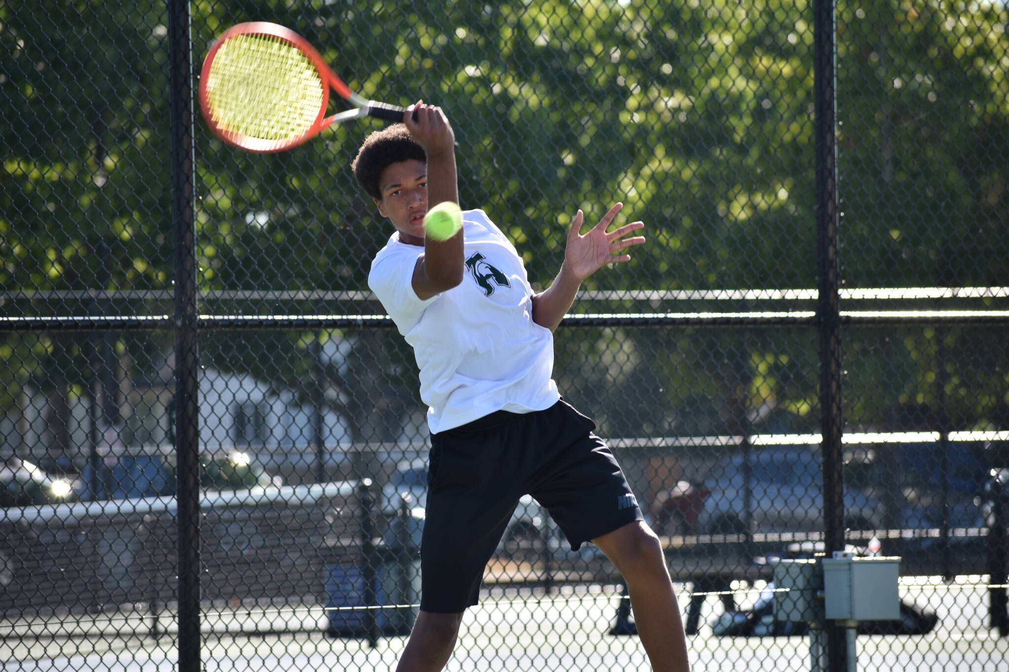 Solomon Smith hits a forehand in the lone win against Thomas Jefferson. Ben Ray / The Reporter