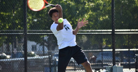 Solomon Smith hits a forehand in the lone win against Thomas Jefferson. Ben Ray / The Reporter