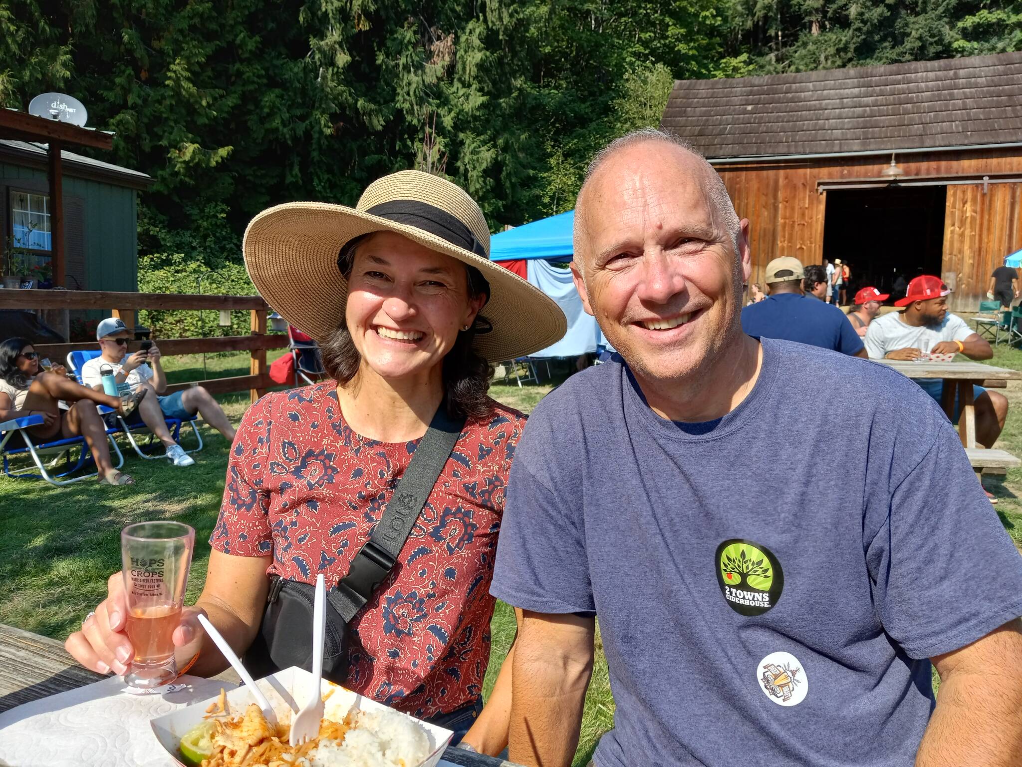 Under a cloudless sky, Angie and Jay Anderson kick back with a sampling of their favorite suds at Auburn’s annual Hops and Crops Festival at Mary Olson Farm on Saturday, Sept. 16.