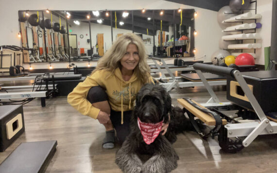 Shelia Cowart at Longevita Pilates and Yoga Studio with her dog. Photo Courtesy of Shelia Cowart.