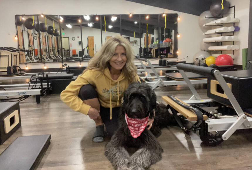 <p>Shelia Cowart at Longevita Pilates and Yoga Studio with her dog. Photo Courtesy of Shelia Cowart. </p>