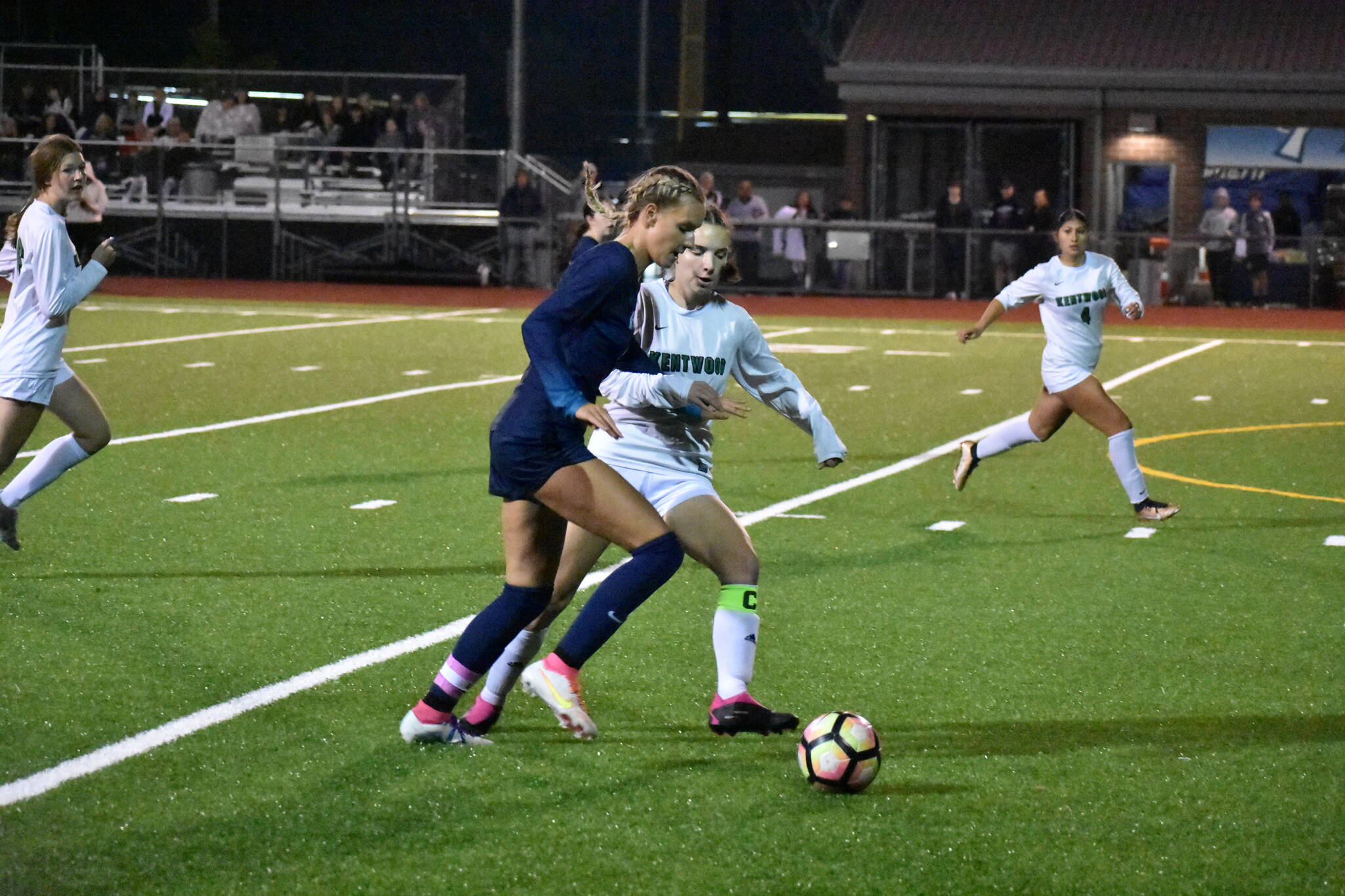 Caitlyn Riggs dribbles the ball against Kentwood. Ben Ray / The Reporter