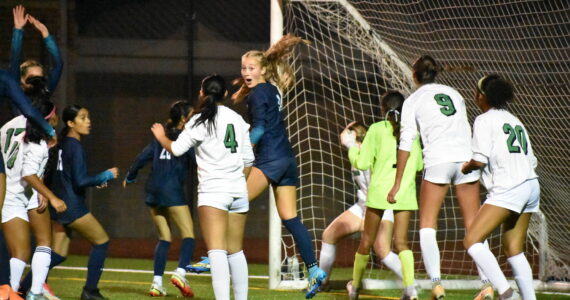 Harper Curnutt with a very animated reaction as the Ravens get their third goal of the game. Ben Ray / The Reporter