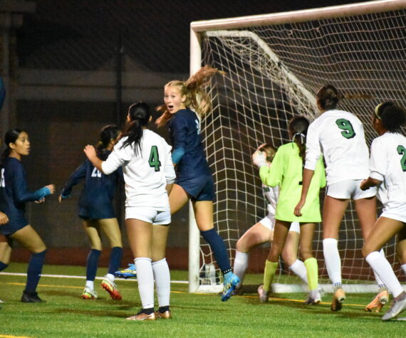Harper Curnutt with a very animated reaction as the Ravens get their third goal of the game. Ben Ray / The Reporter