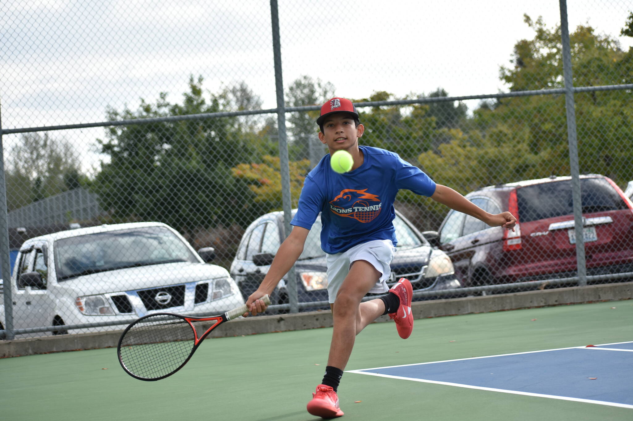 Dominic Weir lunges for a drop shot. Ben Ray / The Reporter