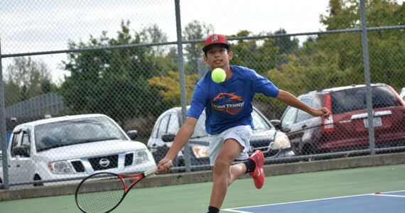 Dominic Weir lunges for a drop shot. Ben Ray / The Reporter