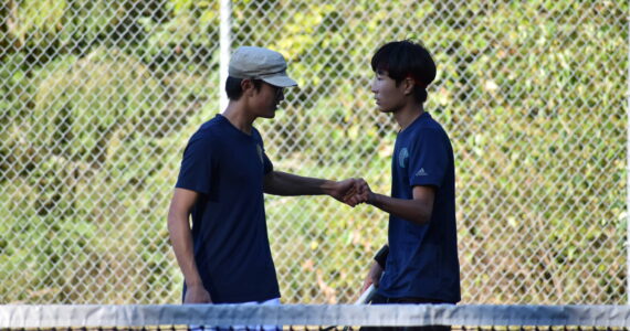 Caleb Choi and Allen Nguyen celebrate after winning a game in the second set. Ben Ray / The Reporter