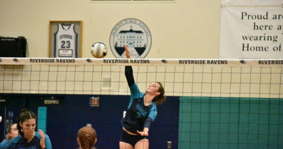Senior Sydney Priebe goes in for the kill in the first set. Ben Ray / The Reporter