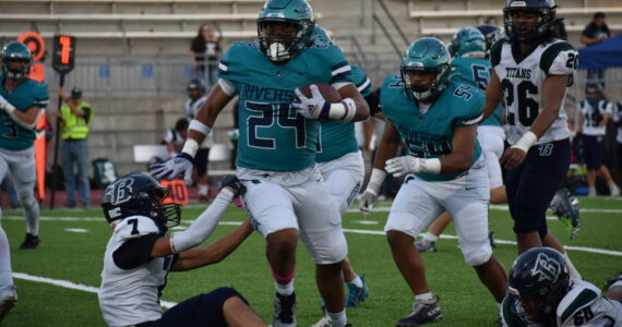 Kyree Wright runs over a Todd Beamer defender. Ben Ray / The Reporter