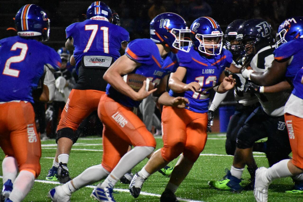 Elijah Baird looks for the hole on his way to a 73-yard score to ice the game. Ben Ray / The Reporter
