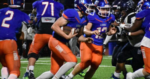 Elijah Baird looks for the hole on his way to a 73-yard score to ice the game. Ben Ray / The Reporter