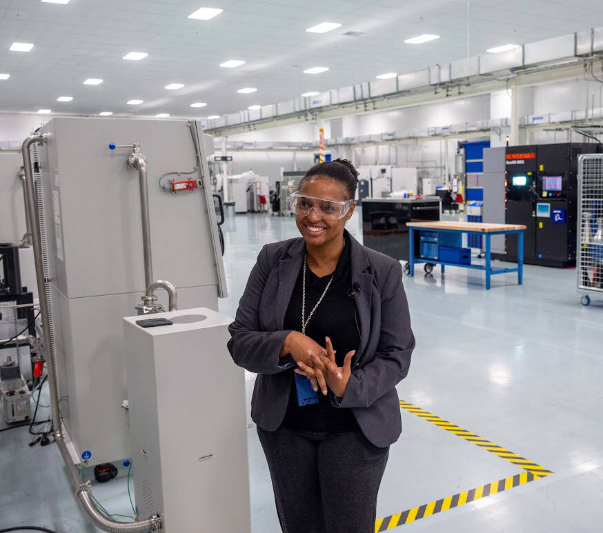 Magnificent Willis, a leader in Boeing product integration, welcomes AWB’s Manufacturing Week tour group Oct. 11 to the Boeing Additive Manufacturing metals print room in Auburn. COURTESY PHOTO, Brian Mittge/Association of Washington Business