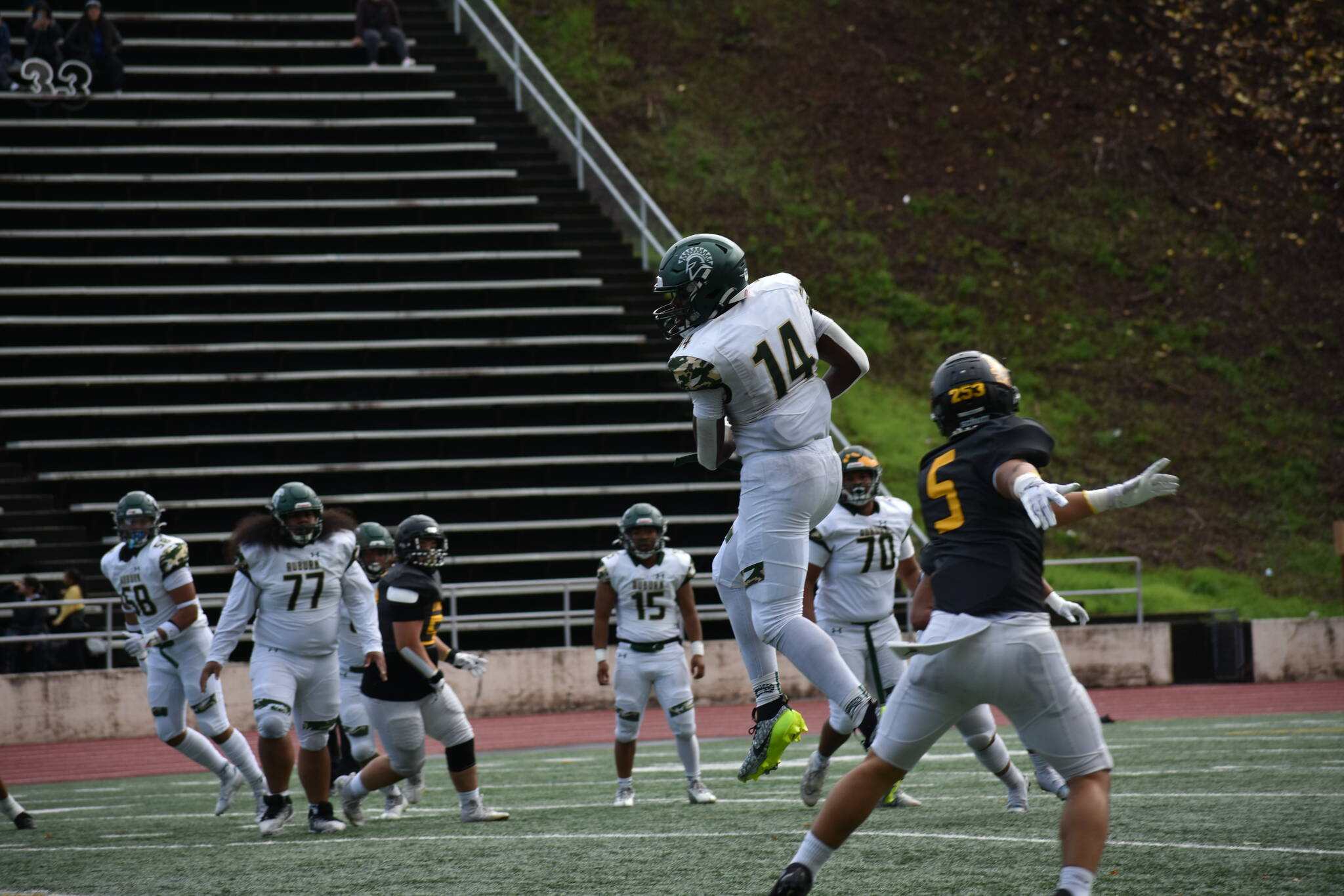 Luvens Valcin makes a catch against Lincoln. (Ben Ray / The Reporter)