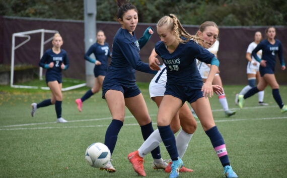 Soph. Harper Curnutt takes possession from a Mead player . Ben Ray / The Reporter