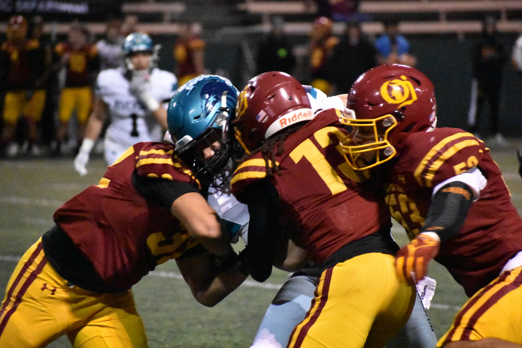 Lucas Lemalu needs three O’Dea defenders to take him down. Ben Ray / The Reporter