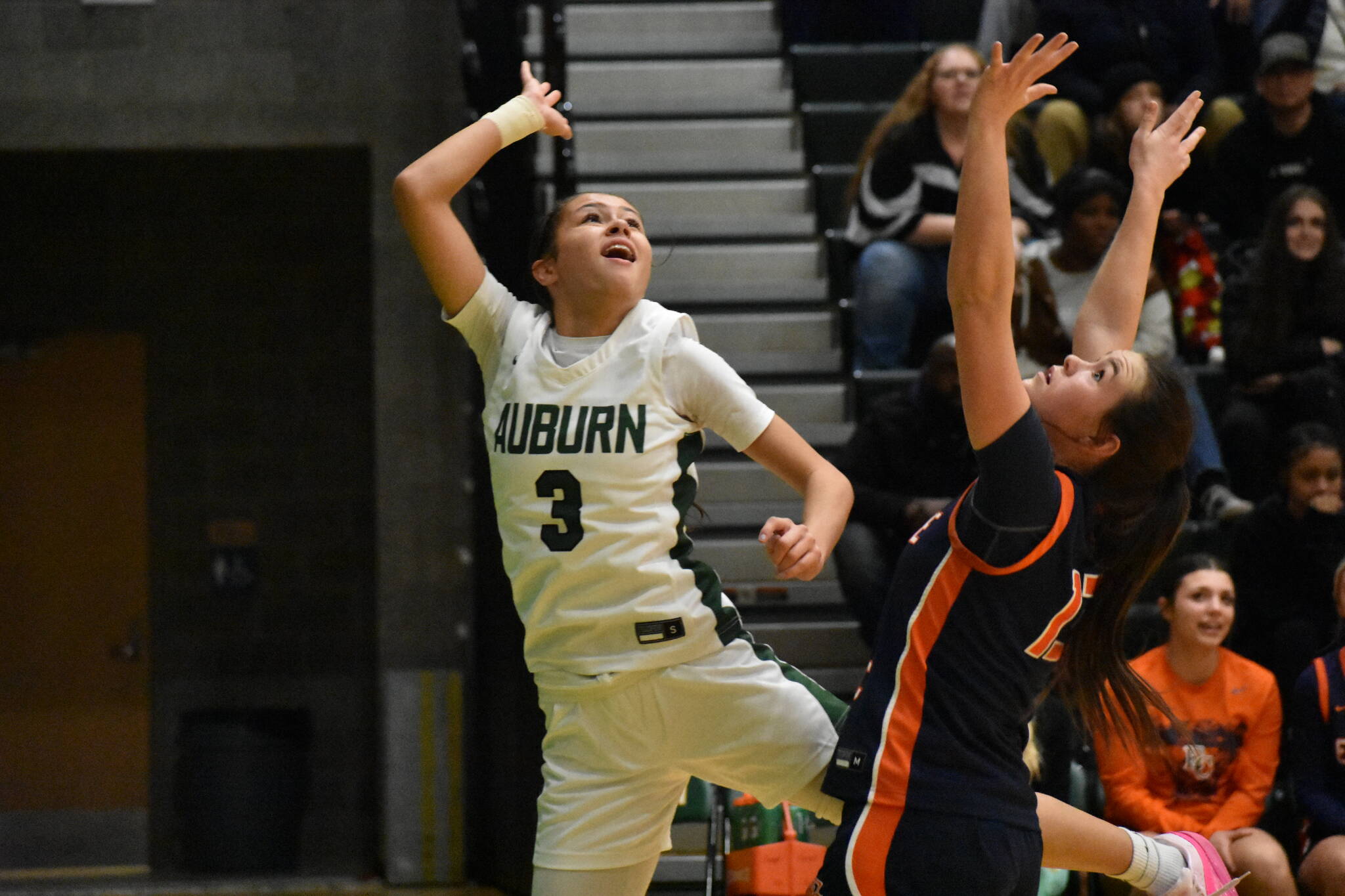 Auburn senior Jayla Brown comes down after a layup attempt. Ben Ray / The Reporter