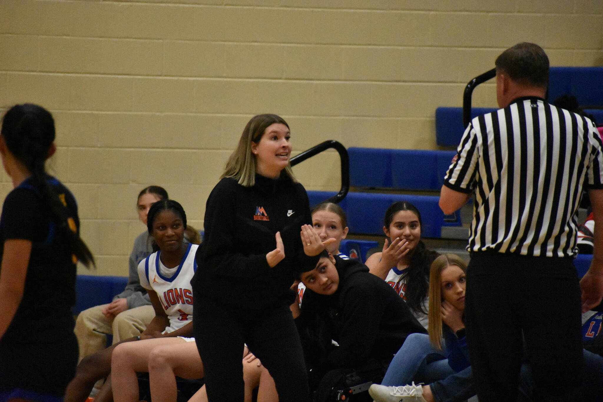 Auburn Mountainview Head Coach Alyse Lacey in an animated discussion with the referee. Ben Ray / The Reporter