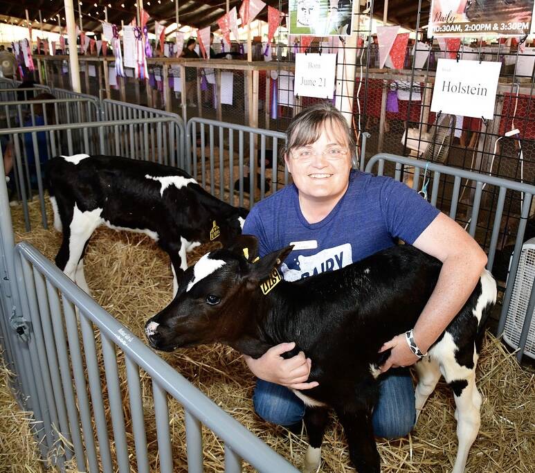 New King County Agricultural Commissioner Leann Krainick with one of her calves at the last King County Fair. (Photo by Heather Curbow)