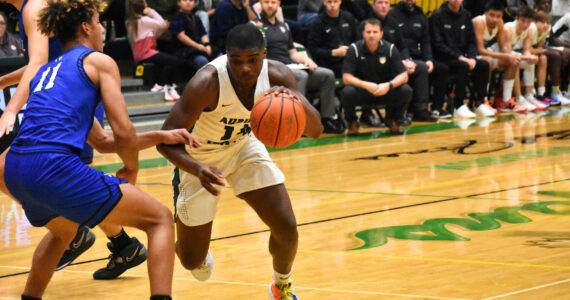 Luvens Valcin drives to the basket in 2022 against Federal Way.