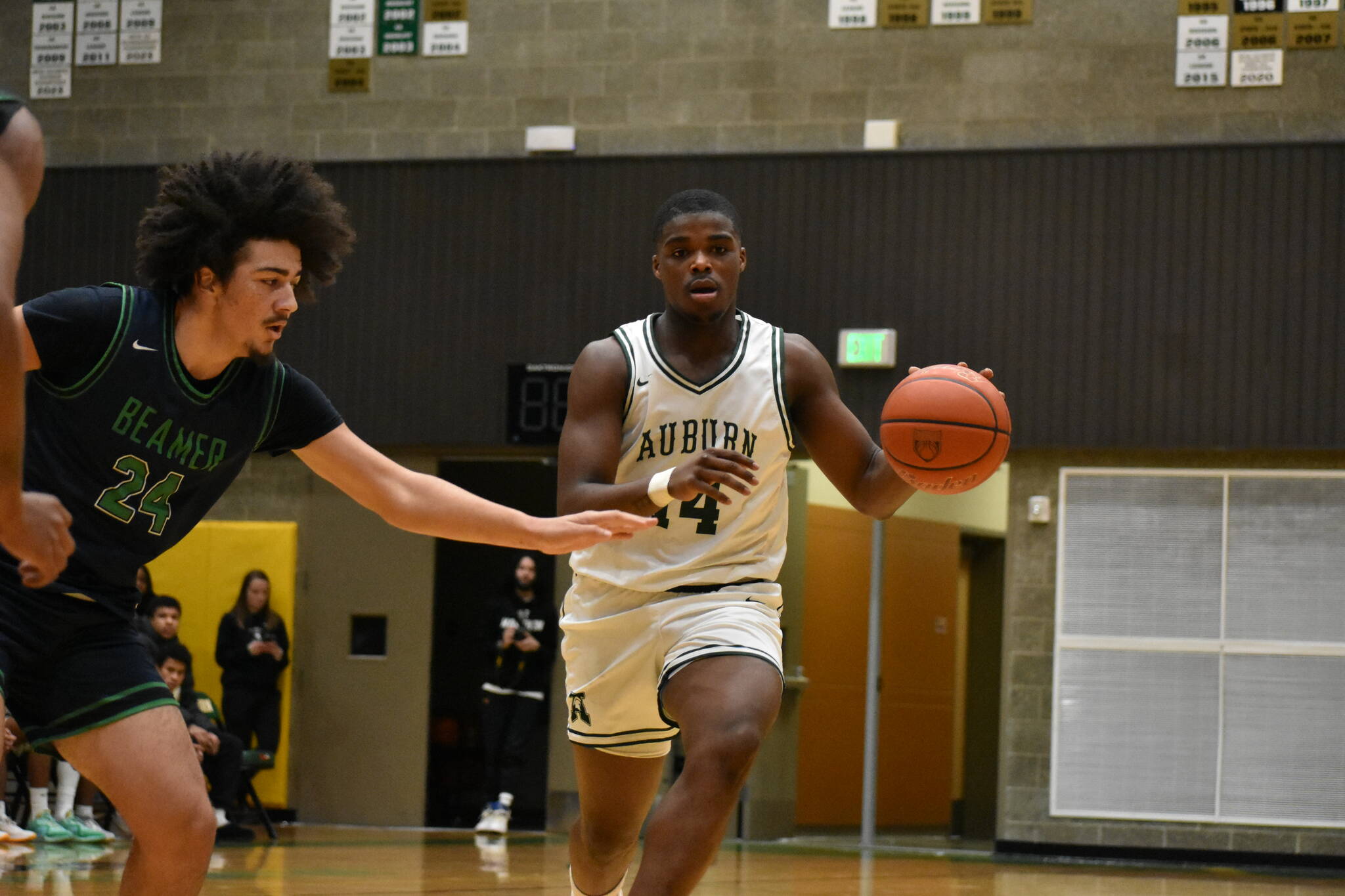 Photos by Ben Ray / The Reporter
Trojan senior Luvens Valcin dribbles the ball for the Auburn High School.