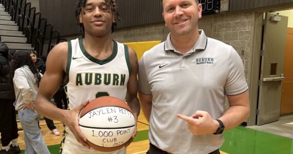 Auburn High School’s Jaylen Petty, left, with coach Ryan Hansen. Courtesy photo