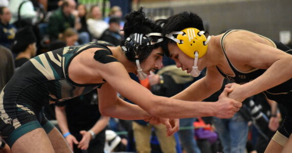 Auburn wrestler is tied up with another wrestler at Todd Beamer. Ben Ray / The Reporter