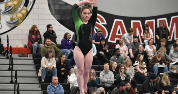 Photos by Ben Ray / The Reporter
Auburn gymnast focuses in during her balance beam routine at Sammamish High School.