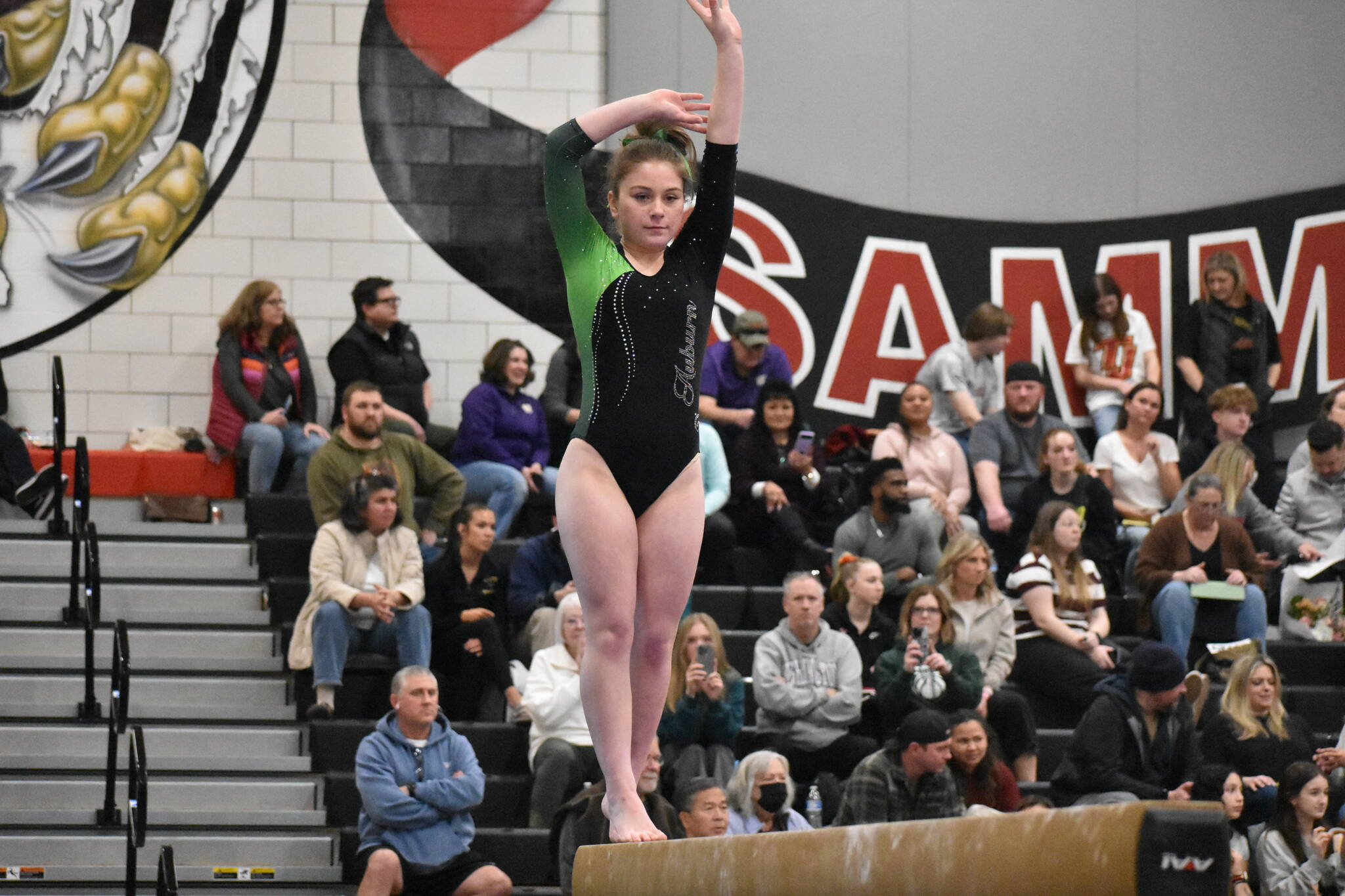 Auburn gymnast focuses in during her balance beam routine at Sammamish High School. Ben Ray / The Reporter