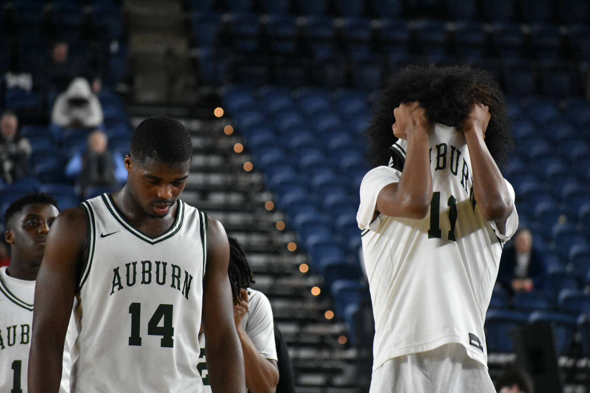 Luvens Valcin and Daniel Johnson walk back to the Auburn bench after being taken down by Lincoln. Ben Ray / The Reporter