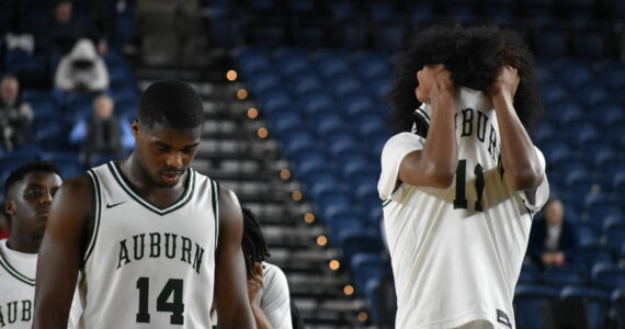 Luvens Valcin and Daniel Johnson walk back to the Auburn bench after being taken down by Lincoln. Ben Ray / The Reporter