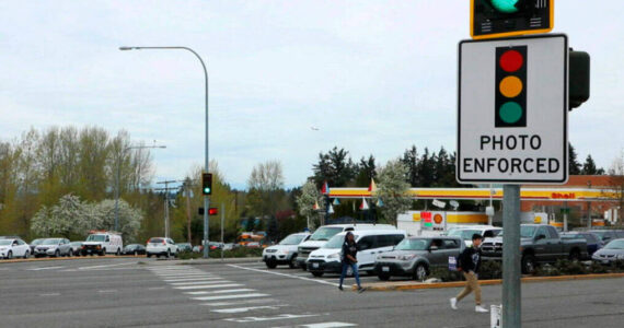 A red-light camera sign at Pacific Highway South and Kent Des Moines Road in Kent. File photo