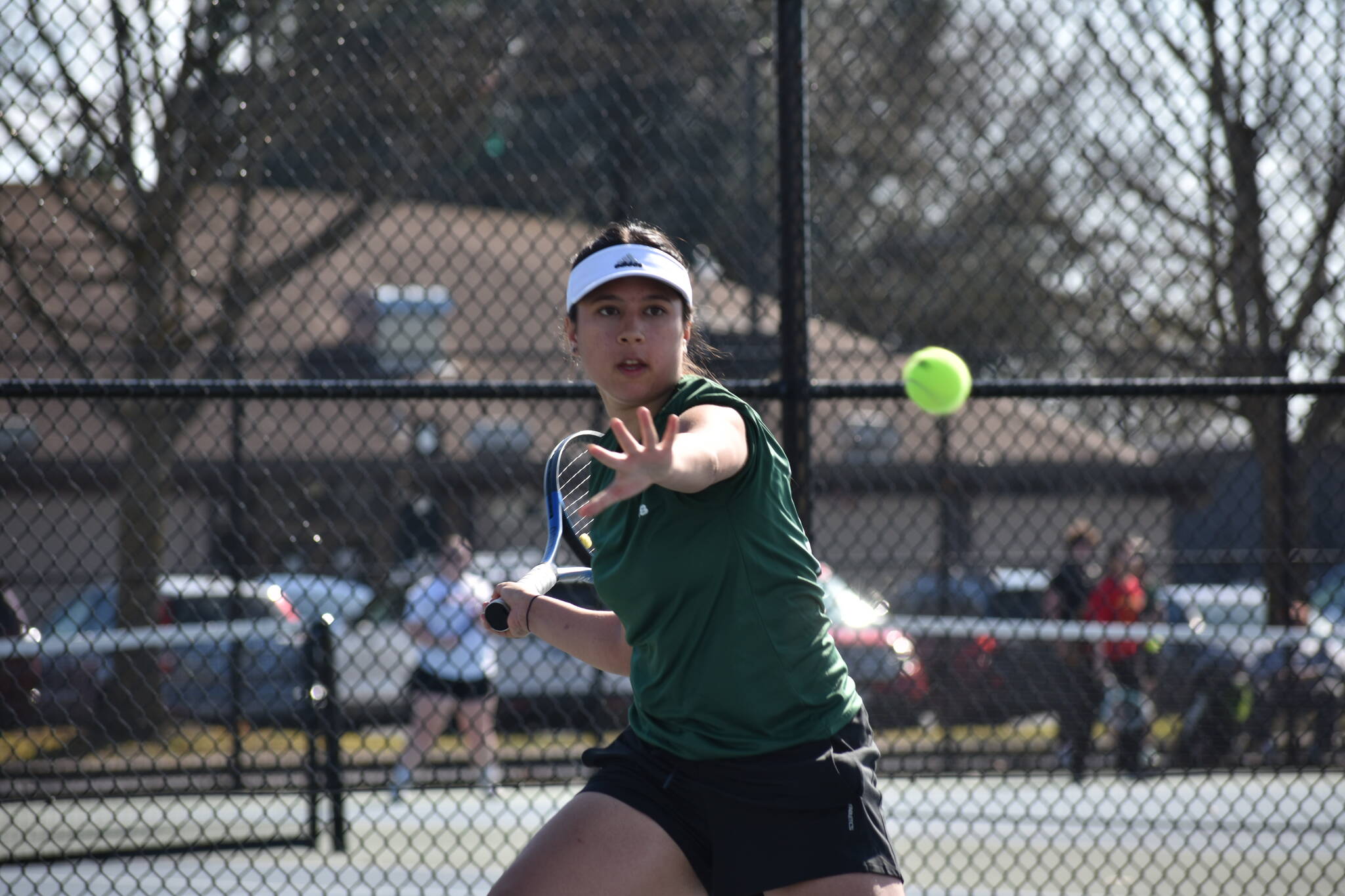 Gabriela Rebutiaco eyes down the ball as she hits a forehand against Thomas Jefferson. Ben Ray / The Reporter