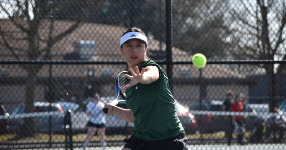 Gabriela Rebutiaco eyes down the ball as she hits a forehand against Thomas Jefferson. Ben Ray / The Reporter