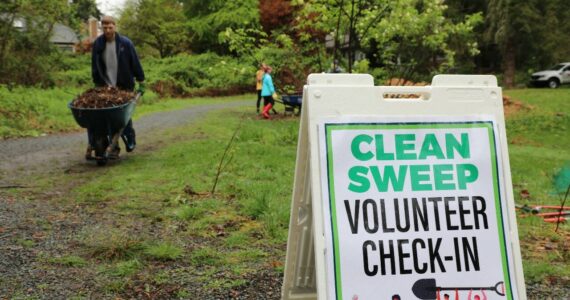 Volunteers spruce up Auburn during the annual Clean Sweep event. File photo