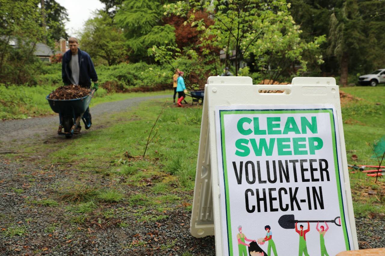 Volunteers spruce up Auburn during the annual Clean Sweep event. File photo