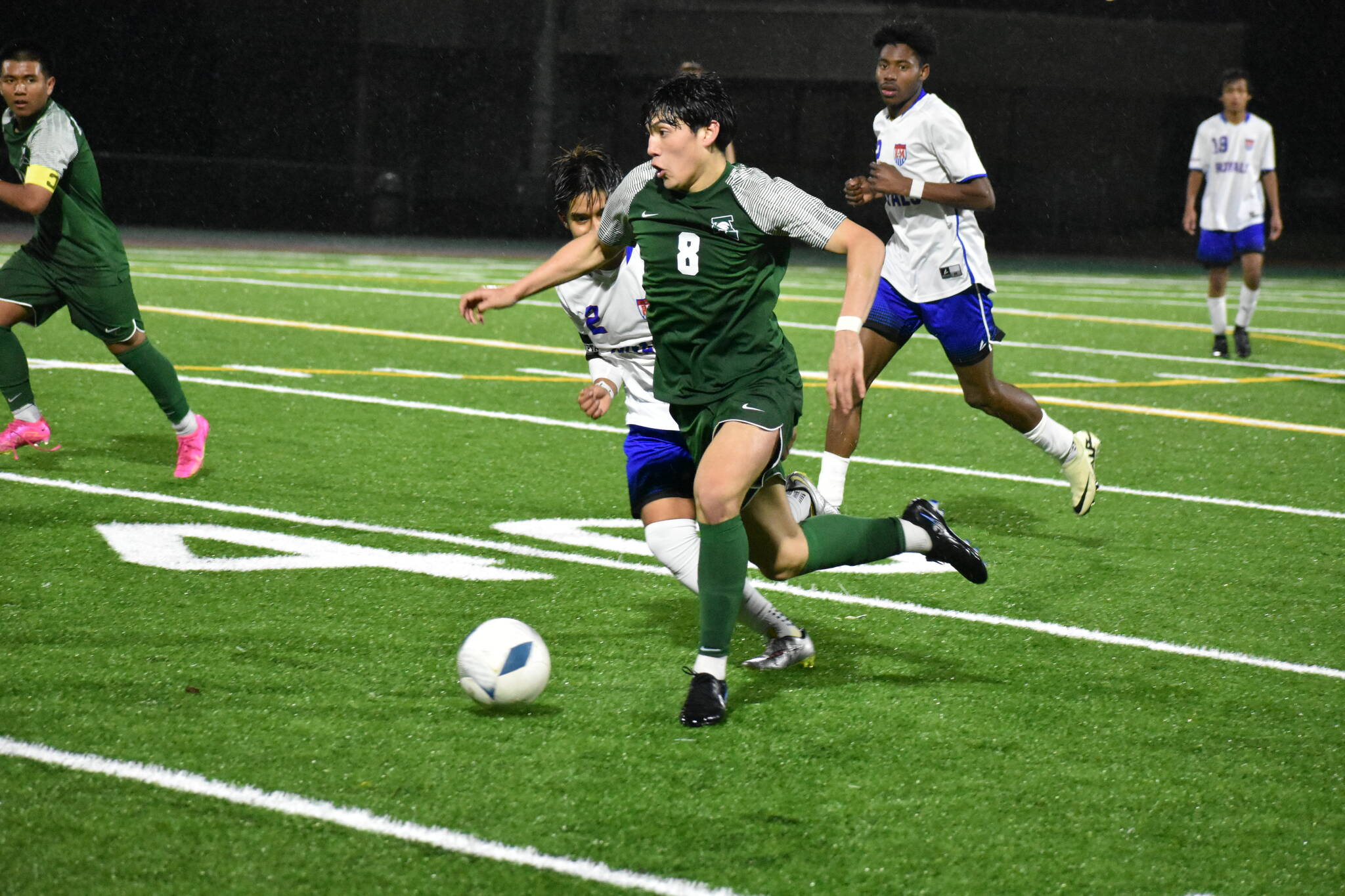 Jesus Magana takes the ball up the field for the Trojans. Ben Ray / The Reporter