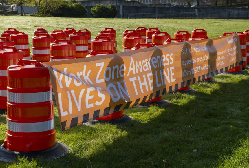 <p>Sixty-one orange traffic barrels were set up April 2, 2024, on the WSDOT front lawn in Olympia. Each cone represents a fallen WSDOT employee killed on the job since 1950 - many in active work zones. The visual display is meant to remind everyone of the importance of slowing down in work zones. Photo courtesy of Washington State Department of Transportation.</p>